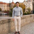 Man wearing grey ribbed roll neck jumper with beige trousers outdoors | Chaps London