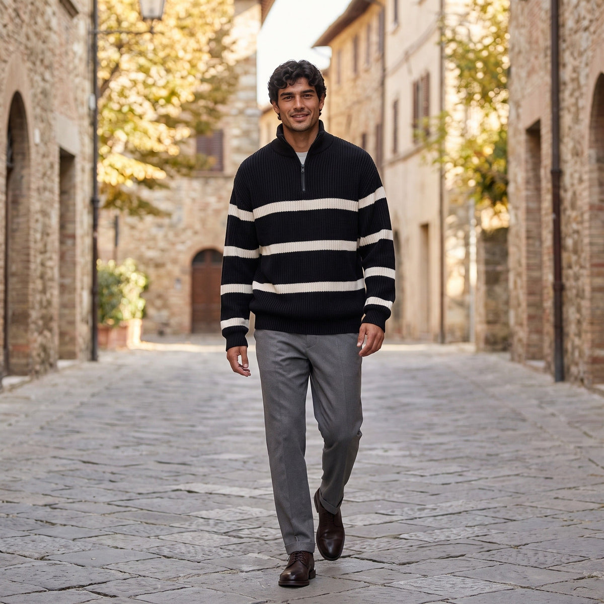 Man wearing black and cream striped half zip jumper on cobblestone street | Chaps London