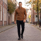 Man wearing rust brown waffle knit quarter zip jumper with black trousers | Chaps London