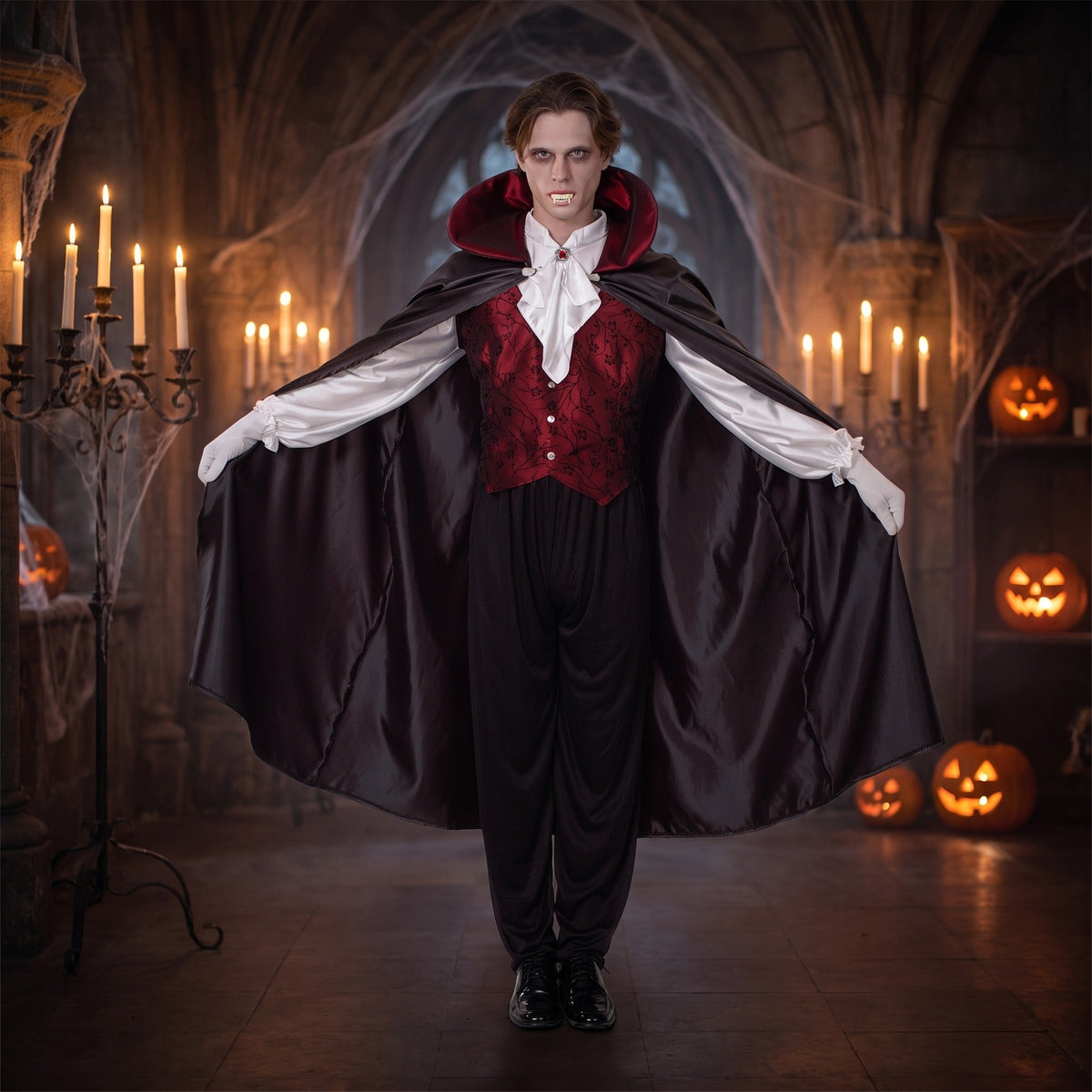 Man wearing black vampire cape with red collar and vest | Chaps London