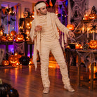 Man wearing beige mummy costume with headband at Halloween party | Chaps London