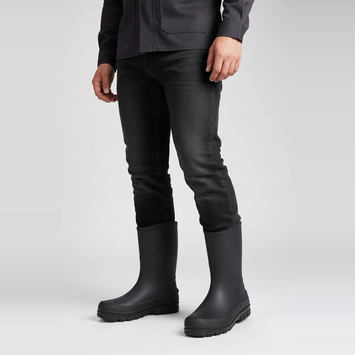 Black mid-calf wellies worn by person, paired with black jeans | Chaps London