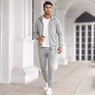 Man wearing grey zip hoodie and matching jogger tracksuit outdoors | Chaps London