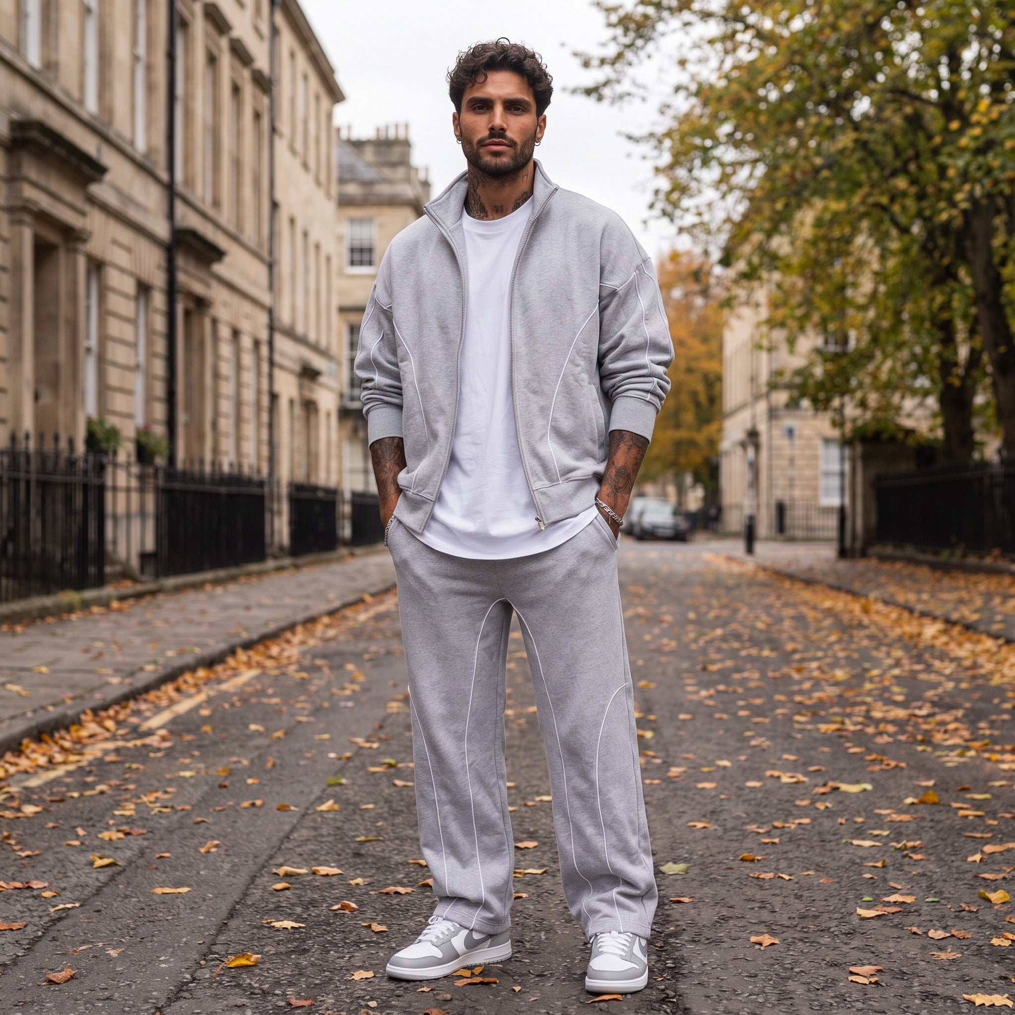 Man wearing light grey zip jacket and matching sweatpants on street | Chaps London