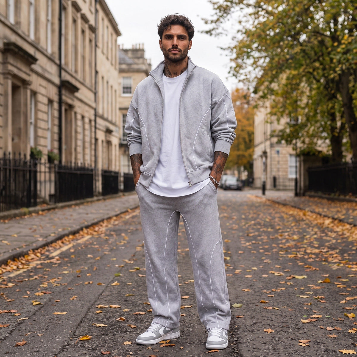 Man wearing light grey zip jacket and matching sweatpants on street | Chaps London