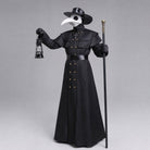 Black plague doctor costume with beak mask, hat, and cane, worn by model | Chaps London