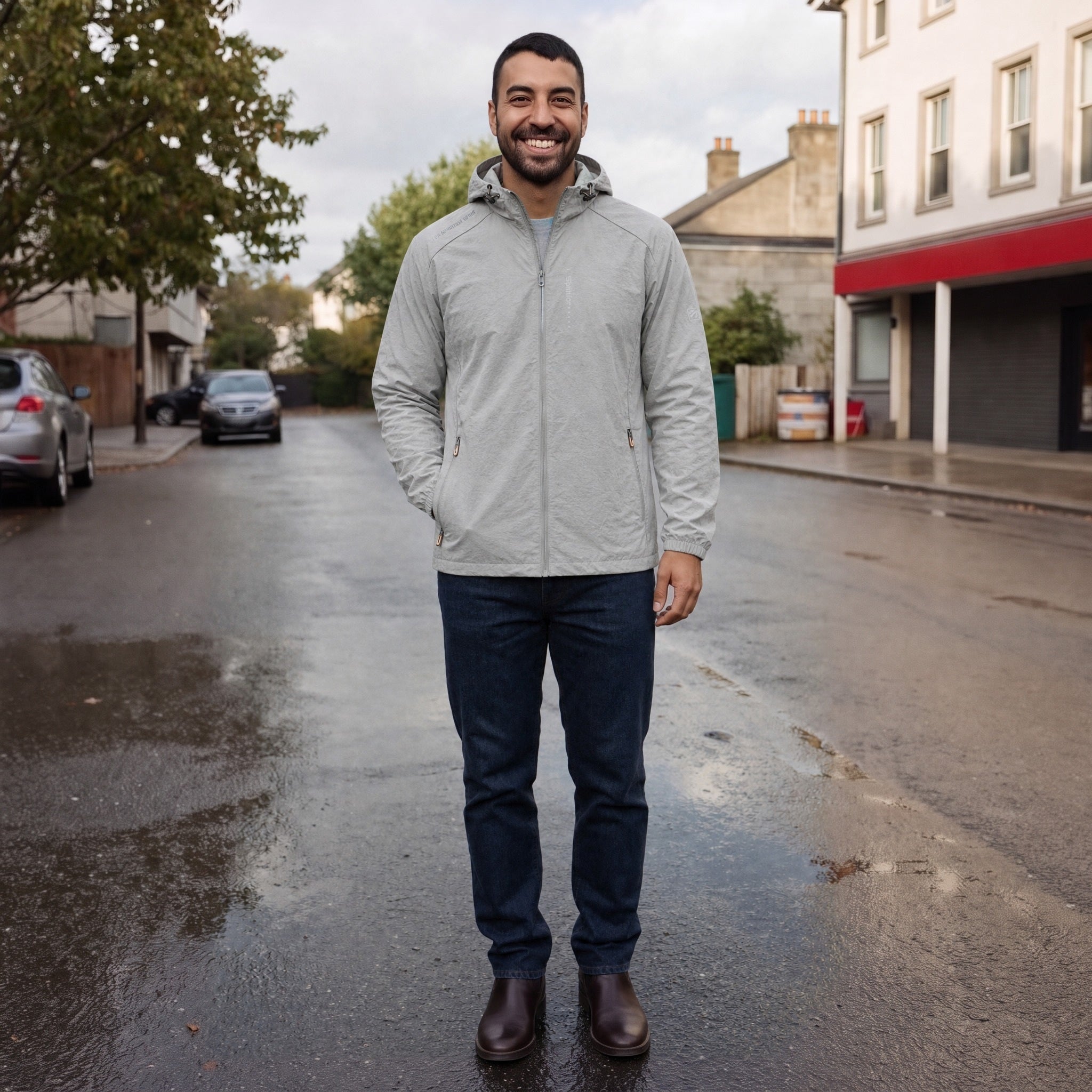 Man wearing gray hooded zip jacket with jeans on street | Chaps London