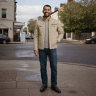 Man wearing beige cotton field jacket with dark jeans on street | Chaps London