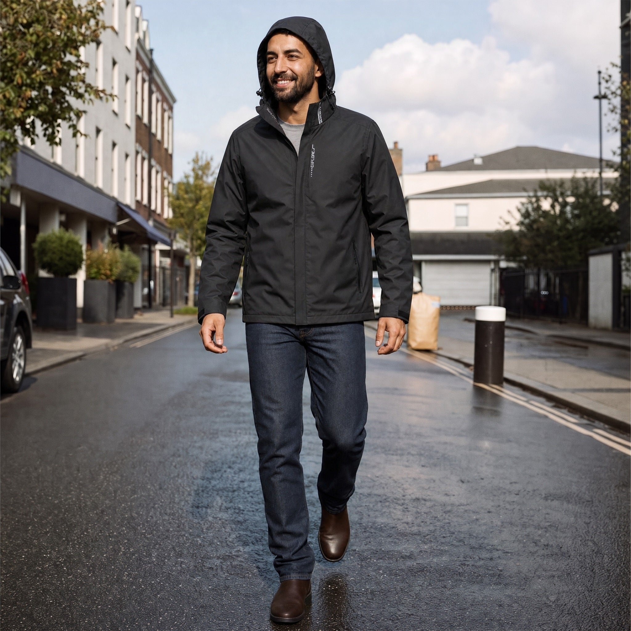 Man wearing black hooded waterproof jacket with jeans, walking on street | Chaps London