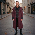 Man wearing burgundy jacquard gothic long coat with black patterned high collar | Chaps London