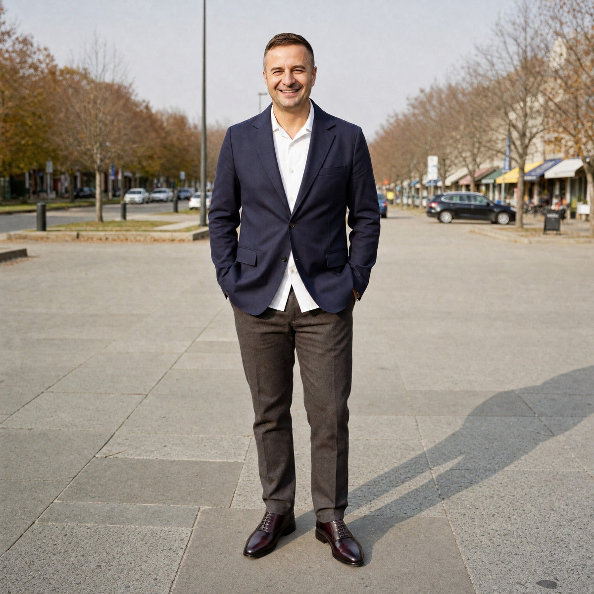 Man wearing brown oxford dress shoes with navy blazer and trousers | Chaps London