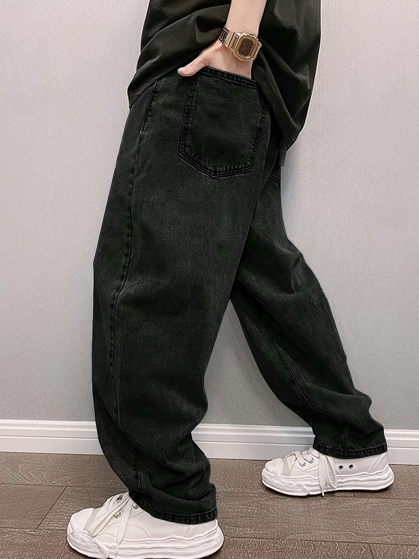Men's baggy stonewash jeans in black, side view