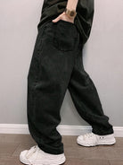 Men's baggy stonewash jeans in black, side view