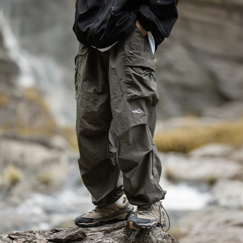 Men's baggy parachute cargo trousers in olive