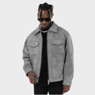 Grey faux suede zip-up jacket worn over a black top