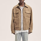 Brown faux suede zip-up jacket worn over a white tee