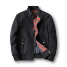 Black Harrington jacket laid flat, half open