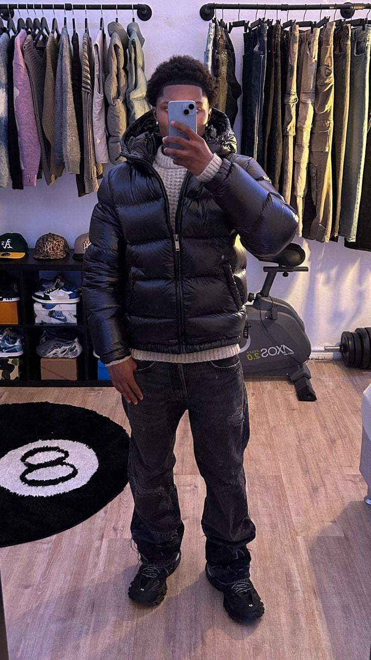 Black shiny hooded puffer jacket zipped up, mirror photo