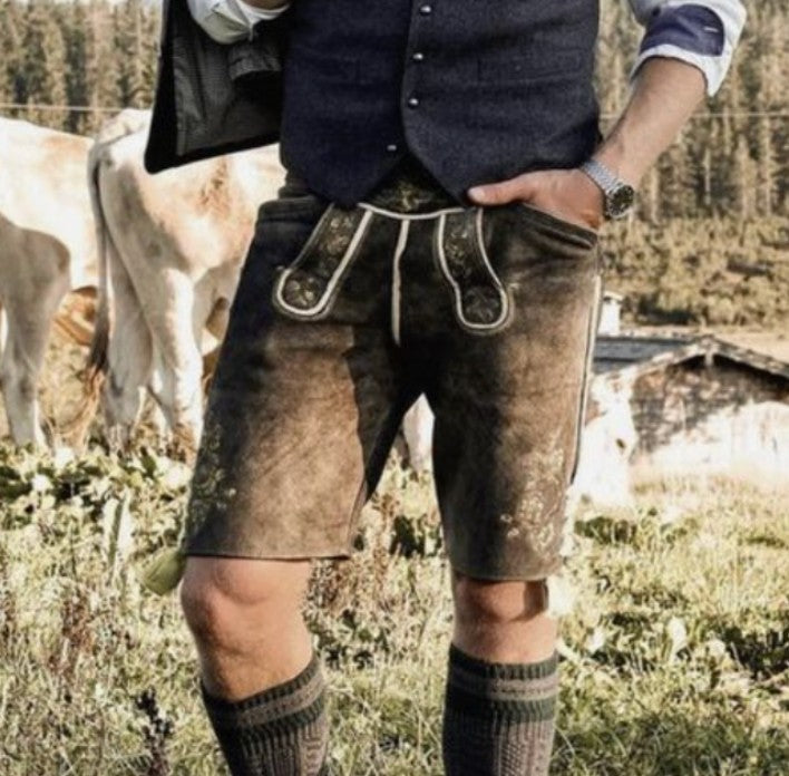 Close-up of men's brown suede lederhosen with an embroidered front flap