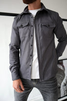 Men's dark grey button-up overshirt with chest pockets
