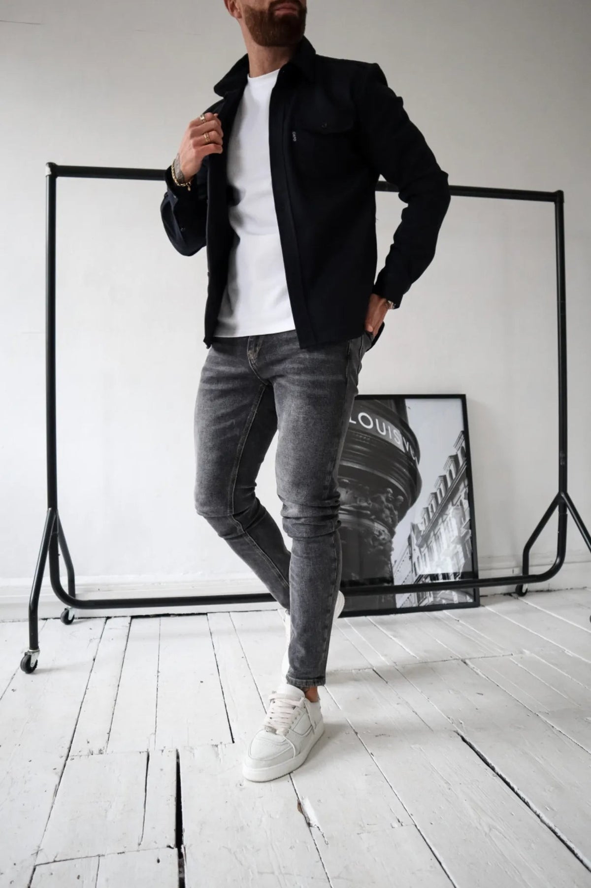 Men's black button-up overshirt with chest pockets