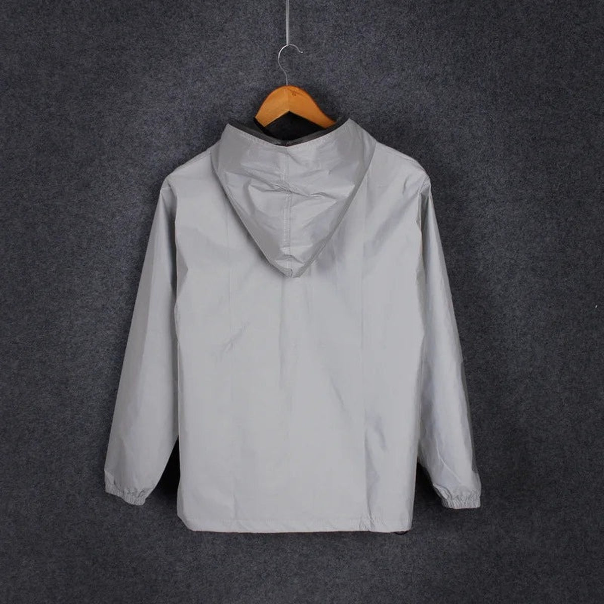 Reflective rain jacket on a hanger, back view with hood