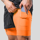 Phone pocket on the orange inner short of the 2-in-1 running shorts