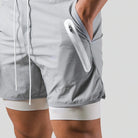 Grey 2-in-1 running shorts with a logo print and a white zip pocket