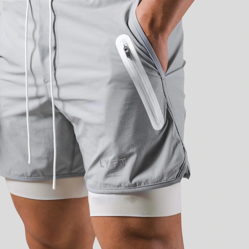 Grey 2-in-1 running shorts with a logo print and a white zip pocket