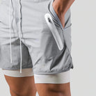 Grey 2-in-1 running shorts with a white zip pocket