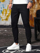 Men's black skinny jeans, front view
