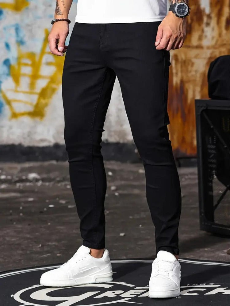 Men's black skinny jeans, front view