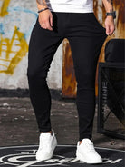 Stretch shown at the hip of the black skinny jeans