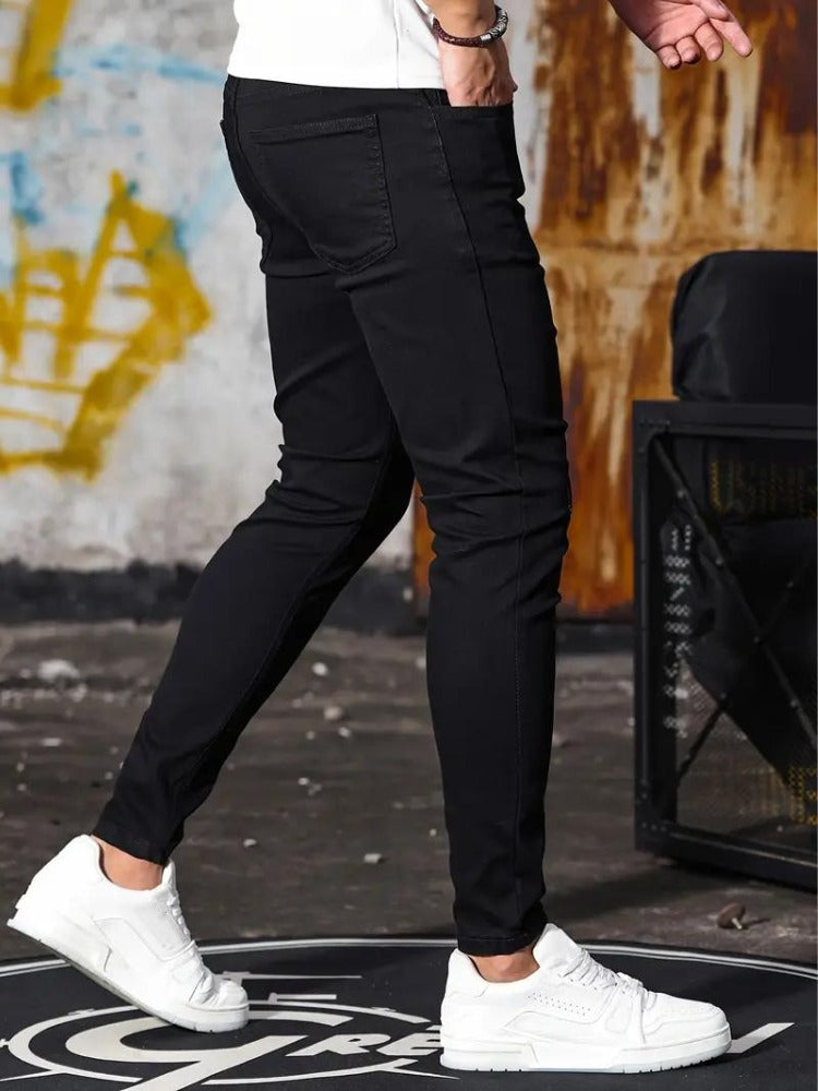 Men's black skinny jeans, side view