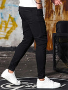 Men's black skinny jeans, side view