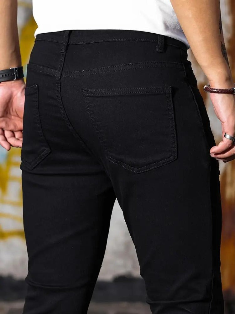 Close-up of the back pocket on the black skinny jeans