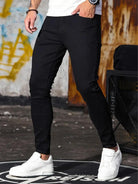 Men's black skinny jeans with white trainers