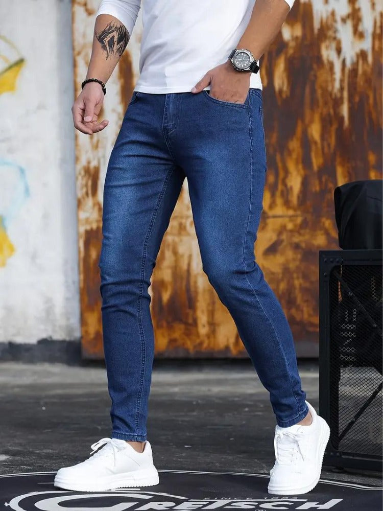 Men's blue skinny jeans, hand in pocket