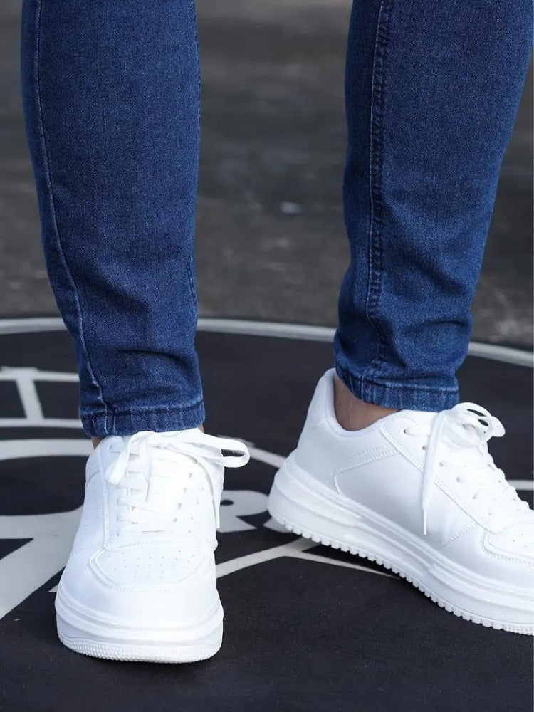 Close-up of the ankle on the blue skinny jeans