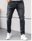 Black distressed skinny jeans worn by man with white sneakers | Chaps London