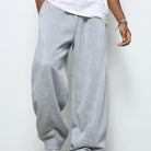 Man wearing gray baggy straight-leg fleece joggers with drawstring waist | Chaps London