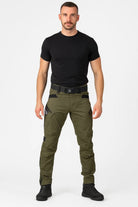 Man wearing olive green tactical cargo trousers with a black T-shirt, front view | Chaps London