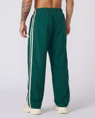 Men's green side-stripe tracksuit bottoms, back view