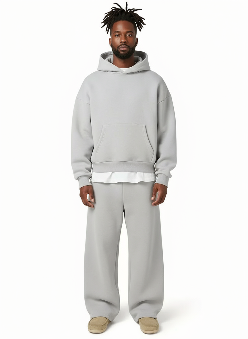 Man wearing grey oversized hoodie and matching straight-leg joggers, full body | Chaps London