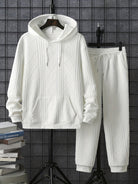 White textured hoodie and joggers set on hangers, front view | Chaps London