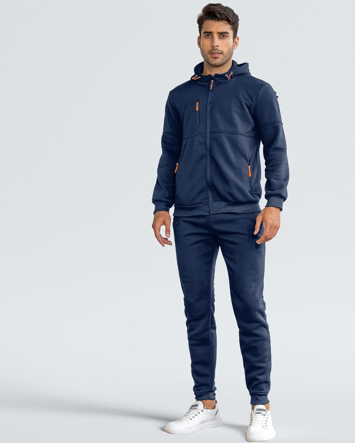Man in a navy zip hoodie and joggers tracksuit, front view | Chaps London