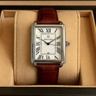 Men's rectangular watch with a silver-tone case and a brown leather strap