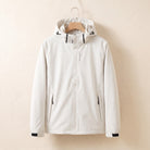 White waterproof jacket with hood on a hanger