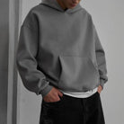 Gray oversized hoodie worn by man with black jeans | Chaps London