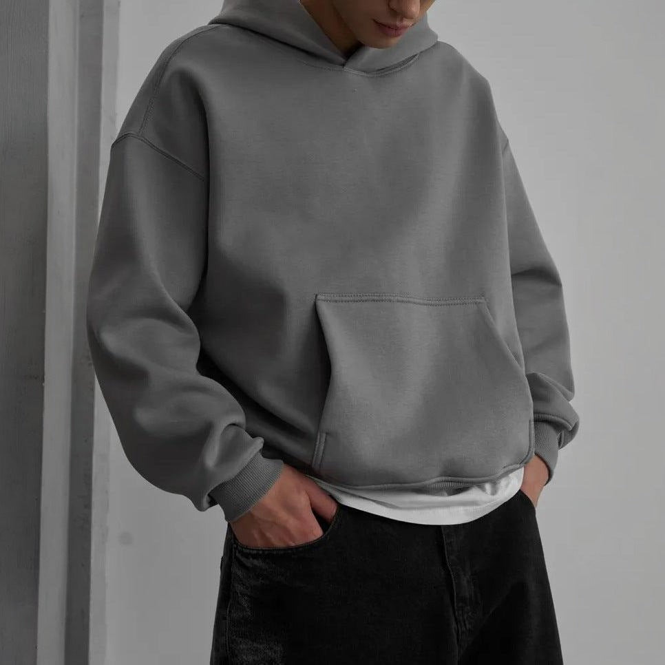 Gray oversized hoodie worn by man with black jeans | Chaps London